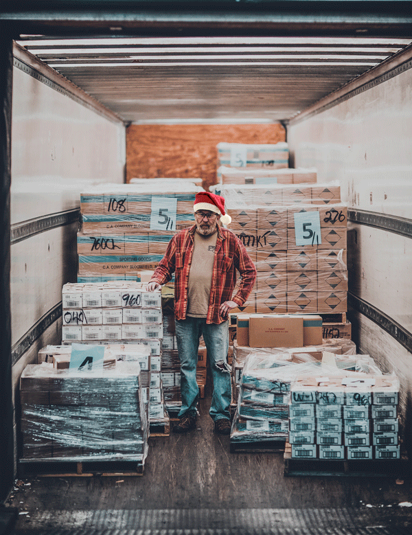 Warehouse Working in Santa Hat